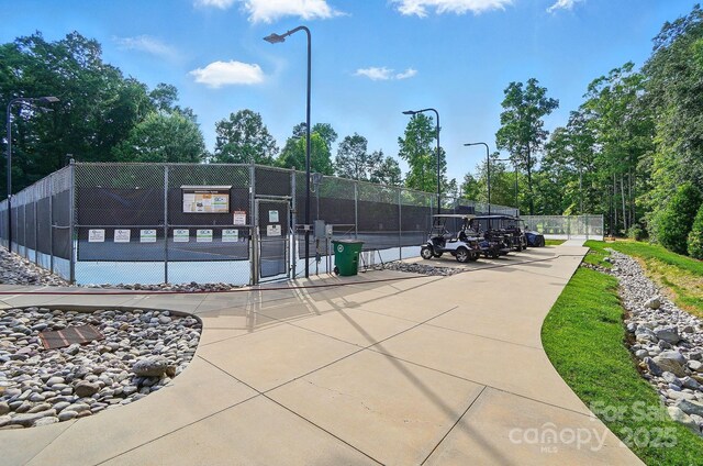 5718 Bardsey Ct, Matthews, NC 28104 - surrounding community with a gate and a tennis court