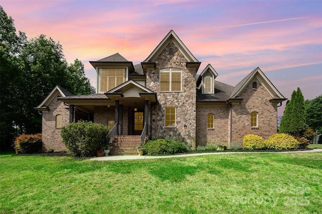 1010 Nutall Oak Ln, Belmont, NC 28012 - craftsman-style home featuring a front lawn, brick siding, covered porch, and stone siding