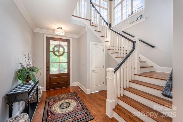 1010 Nutall Oak Ln, Belmont, NC 28012 - foyer featuring stairway, crown molding, baseboards, and wood finished floors