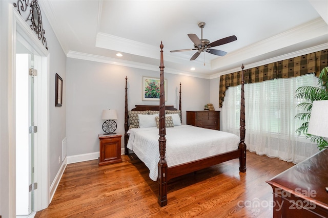 1010 Nutall Oak Ln, Belmont, NC 28012 - bedroom with a raised ceiling, light wood finished floors, and crown molding