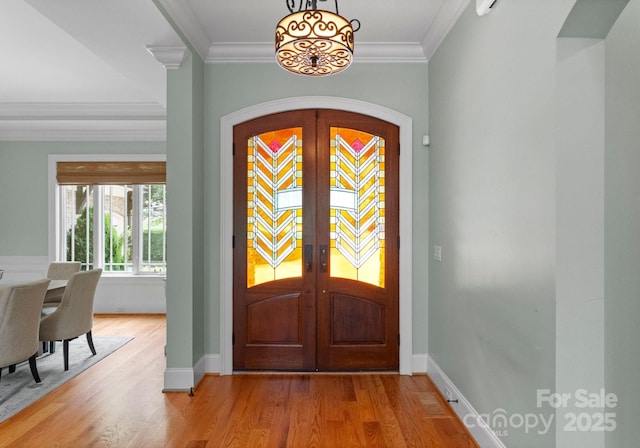 3815 Stoney Ridge Trl, Charlotte, NC 28210 - entrance foyer with french doors, light wood finished floors, ornamental molding, baseboards, and a chandelier