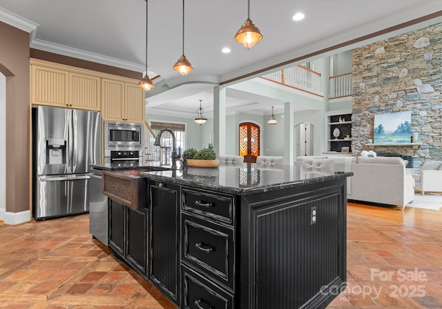 3815 Stoney Ridge Trl, Charlotte, NC 28210 - kitchen with appliances with stainless steel finishes, dark cabinets, cream cabinetry, arched walkways, and dark stone countertops