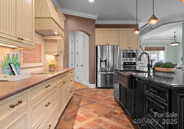 3815 Stoney Ridge Trl, Charlotte, NC 28210 - kitchen with cream cabinets, stainless steel appliances, arched walkways, premium range hood, and crown molding