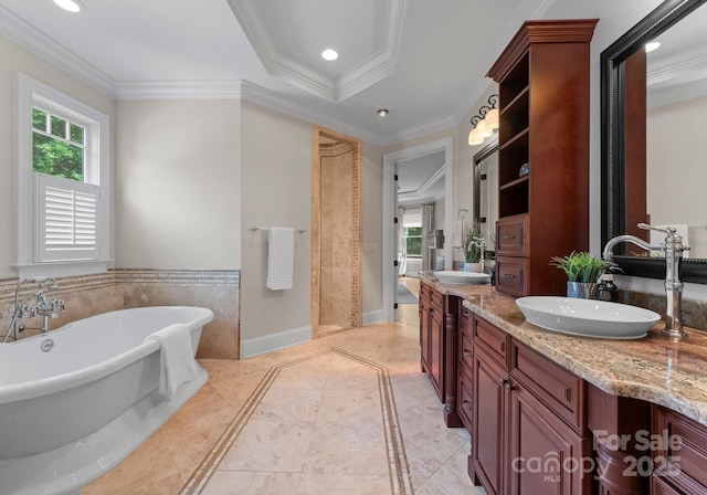 3815 Stoney Ridge Trl, Charlotte, NC 28210 - full bath with double vanity, a freestanding tub, inlaid floor details, ornamental molding, and recessed lighting