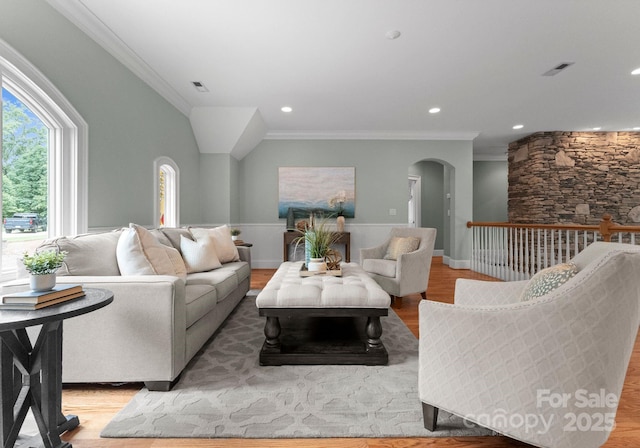 3815 Stoney Ridge Trl, Charlotte, NC 28210 - living room featuring arched walkways, ornamental molding, light wood-type flooring, and recessed lighting