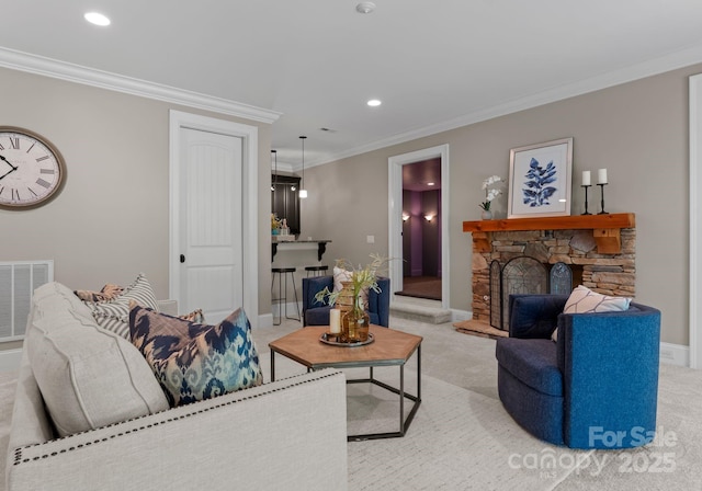 3815 Stoney Ridge Trl, Charlotte, NC 28210 - living area with light carpet, ornamental molding, baseboards, recessed lighting, and a stone fireplace
