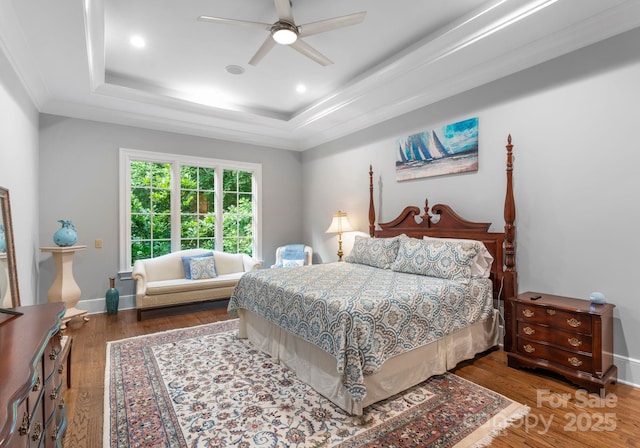 12835 Ninebark Trl, Charlotte, NC 28278 - bedroom with a raised ceiling, wood finished floors, crown molding, ceiling fan, and baseboards