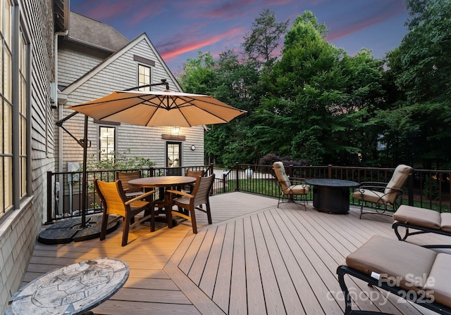 12835 Ninebark Trl, Charlotte, NC 28278 - deck at dusk with outdoor dining space