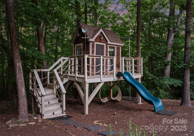 12835 Ninebark Trl, Charlotte, NC 28278 - view of play area with an outdoor structure and view of scattered trees