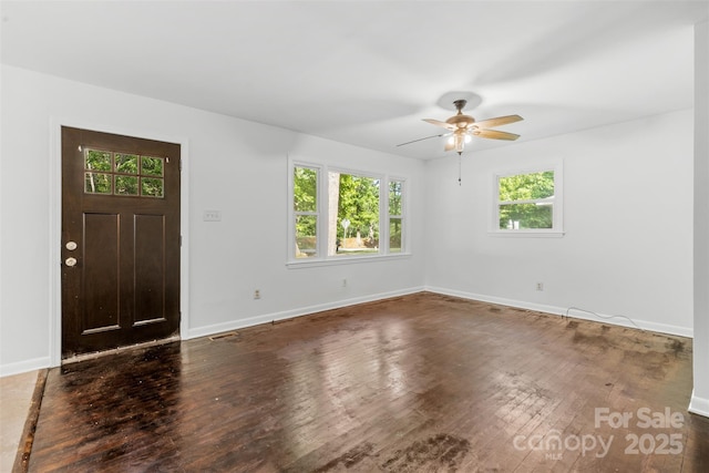 entrance foyer featuring plenty of natural light, wood finished floors, and ceiling fan