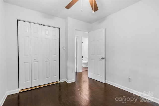 unfurnished bedroom with baseboards, a closet, a ceiling fan, and dark wood-type flooring