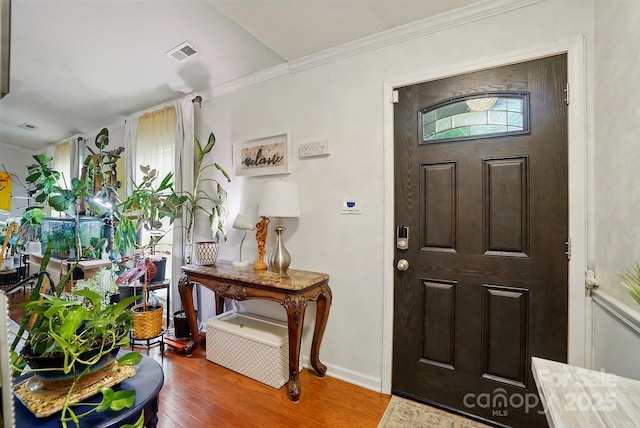 6221 Thermal Rd, Charlotte, NC 28211 - foyer featuring wood finished floors, crown molding, and baseboards