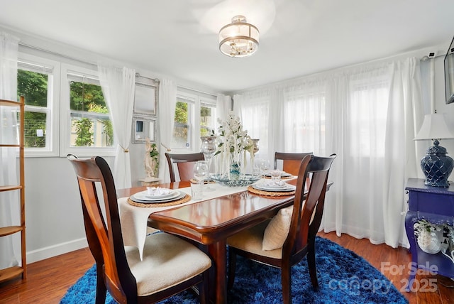 6221 Thermal Rd, Charlotte, NC 28211 - dining room with plenty of natural light, wood finished floors, and a chandelier