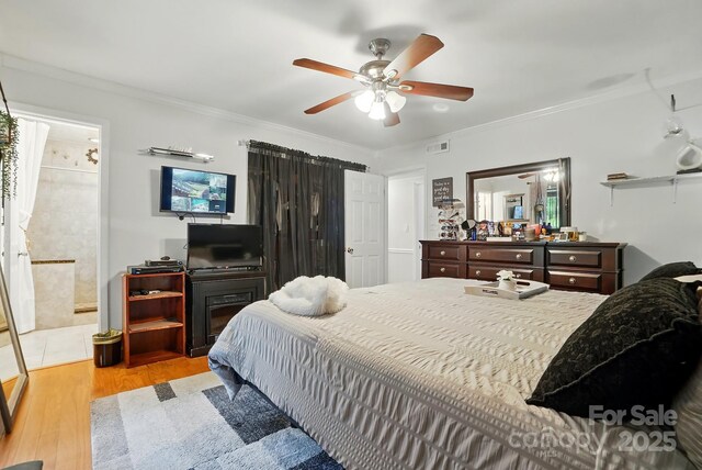 6221 Thermal Rd, Charlotte, NC 28211 - bedroom with light wood finished floors, ornamental molding, and a ceiling fan