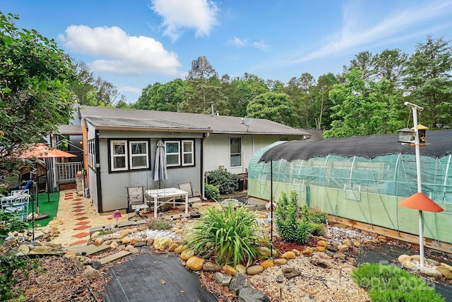 6221 Thermal Rd, Charlotte, NC 28211 - rear view of house with a shingled roof and fence