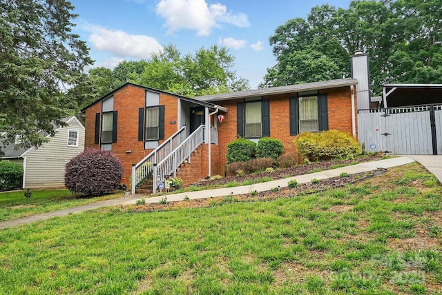 6221 Thermal Rd, Charlotte, NC 28211 - ranch-style home with a front lawn, brick siding, a chimney, and a gate