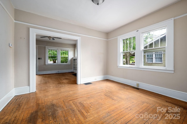 empty room with visible vents and baseboards