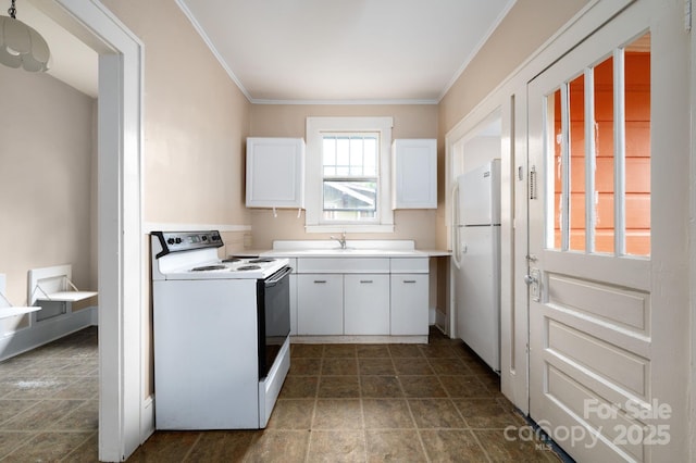 kitchen with white appliances, crown molding, light countertops, stone finish flooring, and white cabinets