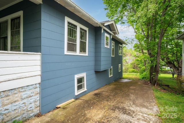 view of side of property featuring a patio