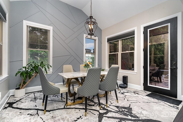 16109 Reynolds Dr, Indian Land, SC 29707 - dining space featuring lofted ceiling, baseboards, and an accent wall