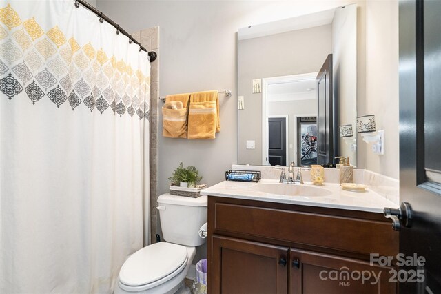 16109 Reynolds Dr, Indian Land, SC 29707 - bathroom with toilet, vanity, and curtained shower
