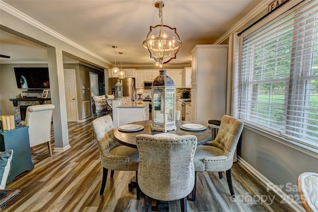 800 Sunset Rd, Cherryville, NC 28021 - dining room with a chandelier, baseboards, dark wood-type flooring, and crown molding