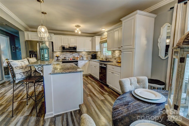 800 Sunset Rd, Cherryville, NC 28021 - kitchen with appliances with stainless steel finishes, a sink, dark wood-type flooring, a kitchen bar, and light stone countertops