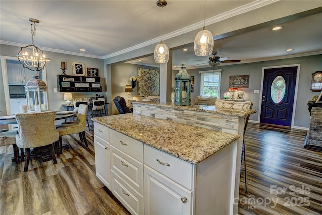 800 Sunset Rd, Cherryville, NC 28021 - kitchen with open floor plan, dark wood-style flooring, a center island, recessed lighting, and ornamental molding