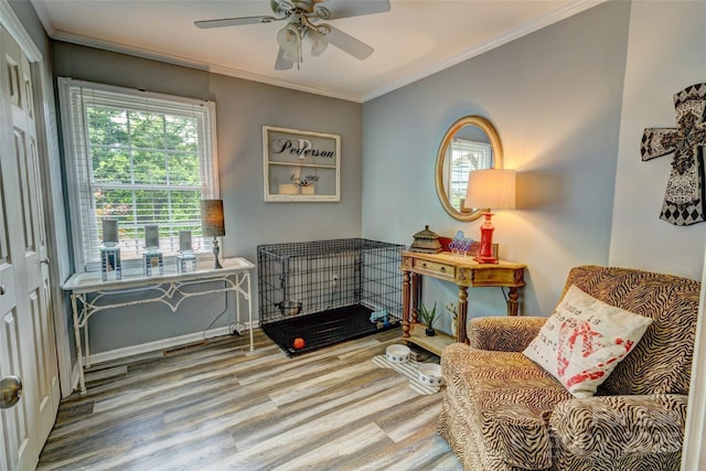 800 Sunset Rd, Cherryville, NC 28021 - living area featuring wood finished floors, crown molding, a ceiling fan, and baseboards
