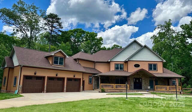 1140 Fern Hill Rd, Mooresville, NC 28117 - view of front of house with a porch, driveway, stone siding, and a front yard