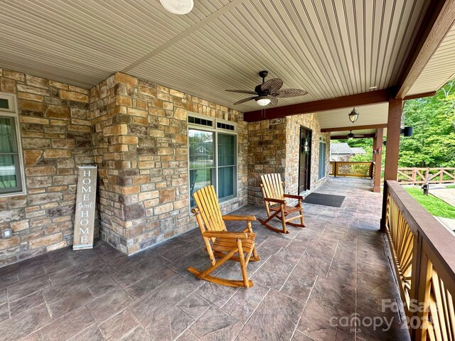 1140 Fern Hill Rd, Mooresville, NC 28117 - view of patio with a ceiling fan and fence