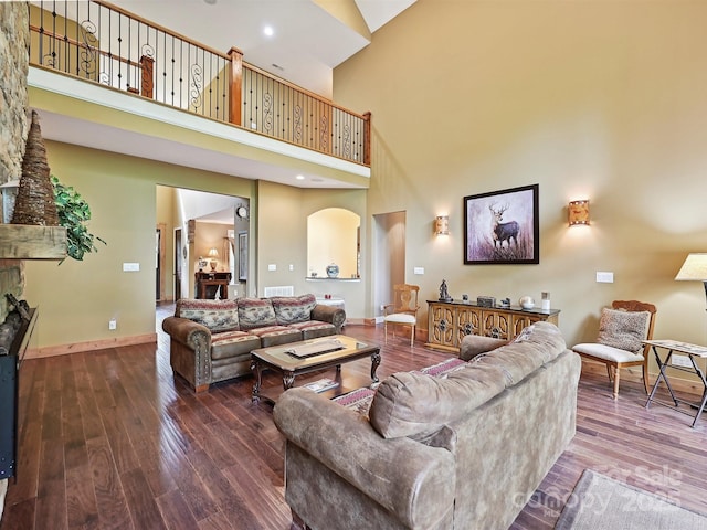 1140 Fern Hill Rd, Mooresville, NC 28117 - living area featuring high vaulted ceiling, baseboards, hardwood / wood-style floors, and arched walkways