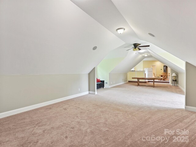 1140 Fern Hill Rd, Mooresville, NC 28117 - additional living space featuring carpet floors, vaulted ceiling, baseboards, and ceiling fan