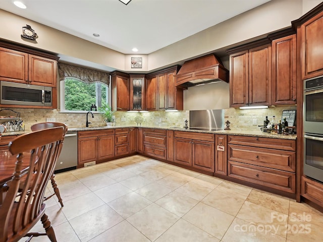 1140 Fern Hill Rd, Mooresville, NC 28117 - kitchen with stainless steel appliances, custom range hood, a sink, tasteful backsplash, and recessed lighting