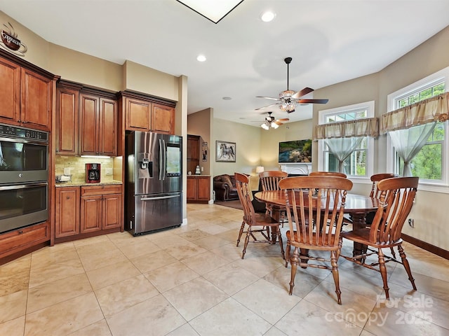 1140 Fern Hill Rd, Mooresville, NC 28117 - dining room with healthy amount of natural light, recessed lighting, a ceiling fan, light tile patterned floors, and baseboards