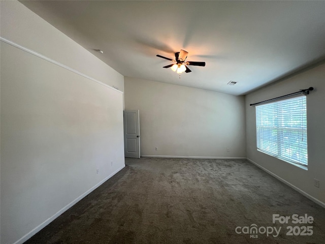 unfurnished room with a ceiling fan, baseboards, visible vents, and carpet floors