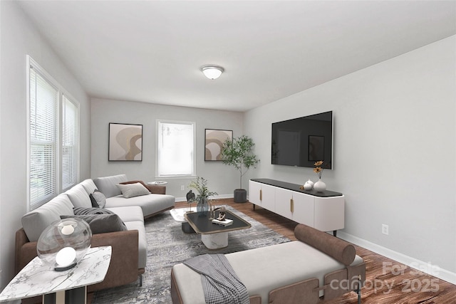 living area featuring baseboards and wood finished floors