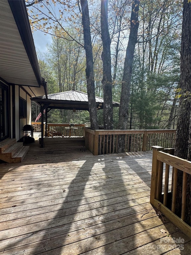 wooden terrace with a gazebo