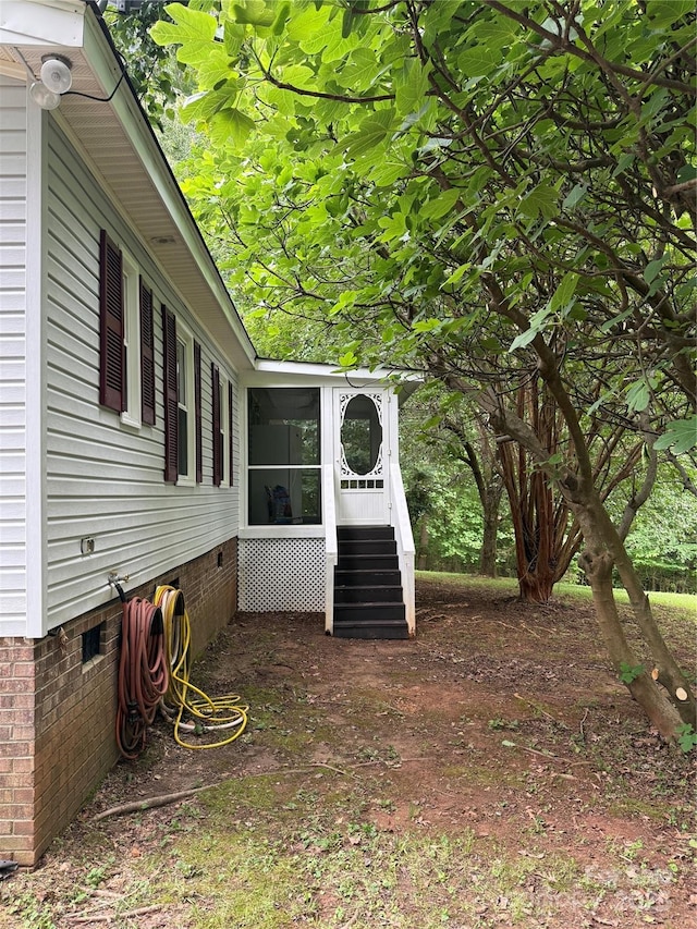 view of yard with a sunroom