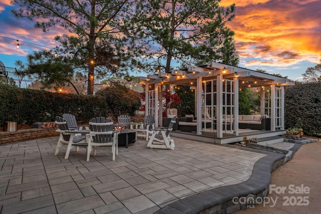18823 Peninsula Cove Ln, Cornelius, NC 28031 - patio terrace at dusk featuring a pergola, an outdoor living space, and a patio