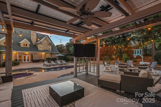 18823 Peninsula Cove Ln, Cornelius, NC 28031 - wooden terrace with a ceiling fan, a patio, an outdoor pool, a pergola, and french doors