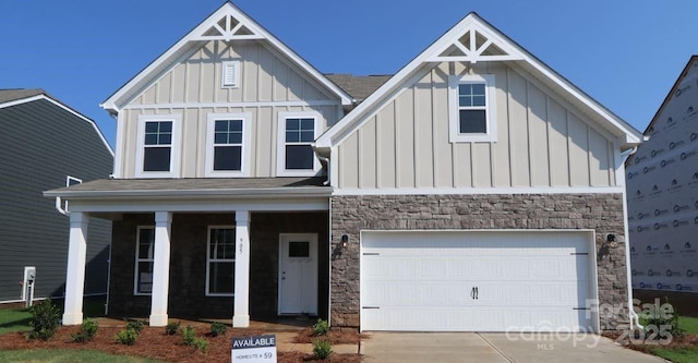 905 Barker St, Monroe, NC 28112 - craftsman house with board and batten siding, driveway, stone siding, and a porch