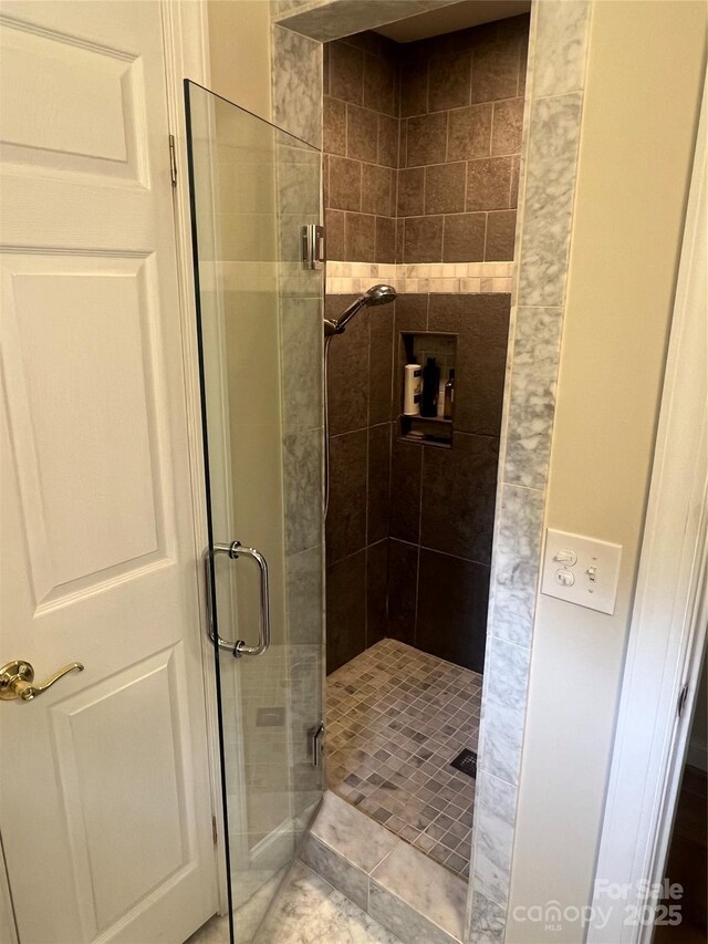 bathroom featuring a stall shower