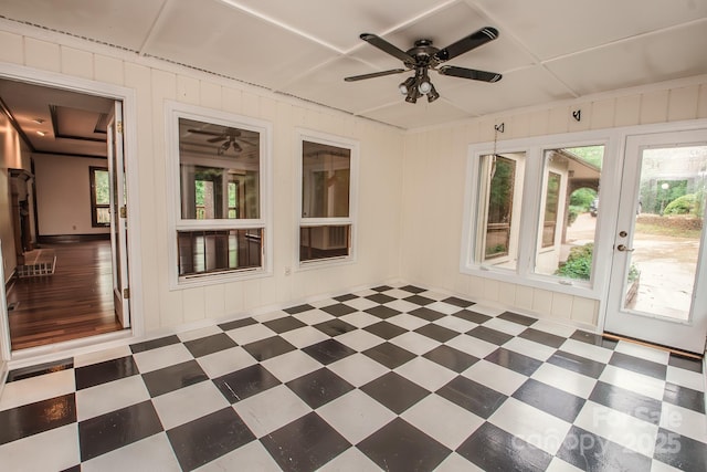 unfurnished sunroom featuring tile patterned floors