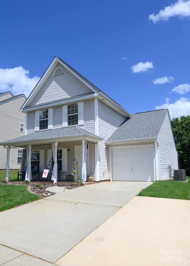 greek revival inspired property with covered porch, an attached garage, central AC, concrete driveway, and a shingled roof