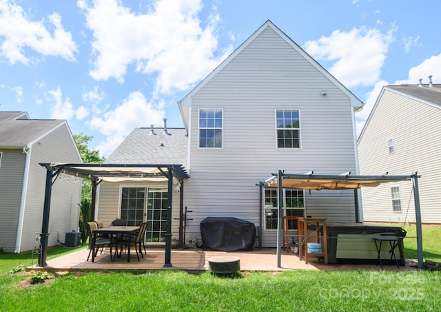 rear view of house featuring a yard, a hot tub, a patio area, central air condition unit, and a pergola