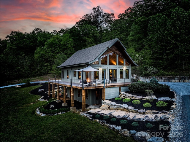 55 Maynards Way, Hendersonville, NC 28792 - back of property featuring a lawn, a deck, and a shingled roof