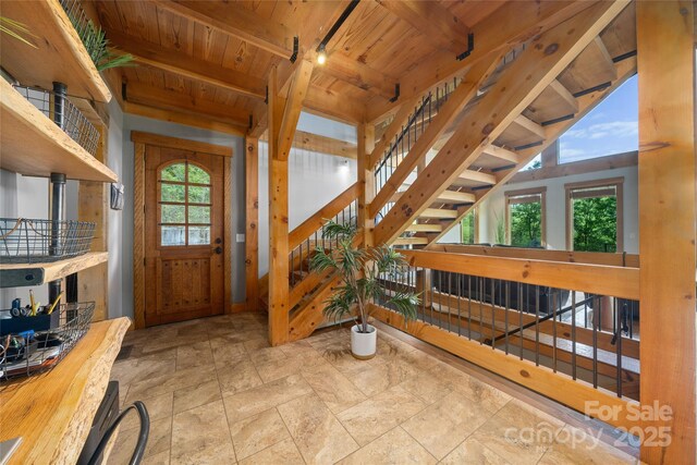 55 Maynards Way, Hendersonville, NC 28792 - entrance foyer featuring wood ceiling, beamed ceiling, stone finish flooring, and stairway