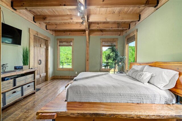 55 Maynards Way, Hendersonville, NC 28792 - bedroom with wooden ceiling, multiple windows, wood finished floors, beamed ceiling, and baseboards