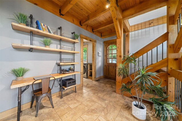 55 Maynards Way, Hendersonville, NC 28792 - entrance foyer with wooden ceiling, beamed ceiling, baseboards, stairway, and washing machine and dryer
